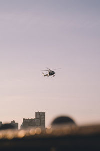 Low angle view of airplane flying in sky