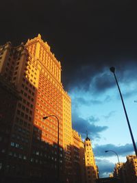 Low angle view of illuminated buildings against sky