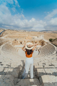 Full length of woman standing at historic amphitheater