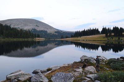 Scenic view of lake and mountains against sky