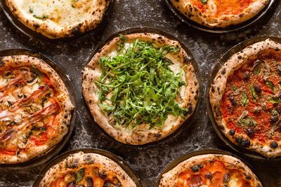 Directly above shot of pizza on table in restaurant