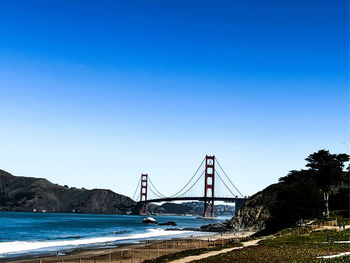 A photo of the golden gate bridge looking into the san fransisco bay.