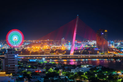 Illuminated tran thi ly cable-stayed bridge is brilliant at the evening in da nang city, vietnam