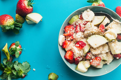 High angle view of chopped fruits in bowl on table