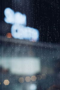 Close-up of wet airplane window