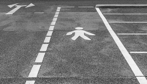 High angle view of arrow sign on road