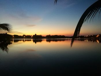 Scenic view of lake against sky during sunset