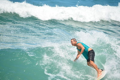 Man surfing in sea