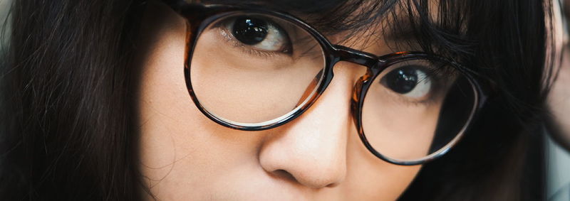 Close-up of woman wearing eyeglasses