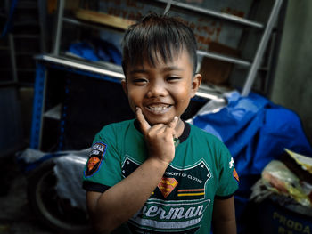 Portrait of smiling boy standing outdoors