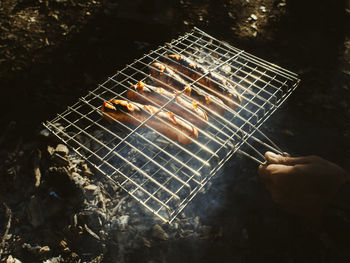High angle view of people on barbecue grill