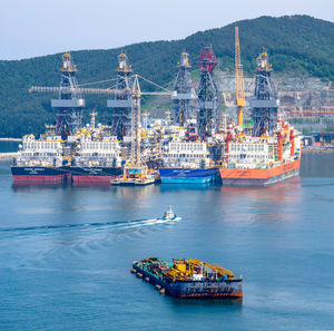 View of boats in sea against sky