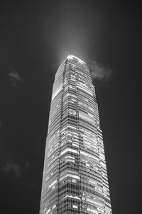 Low angle view of modern building against sky at night