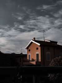 Houses and buildings against sky