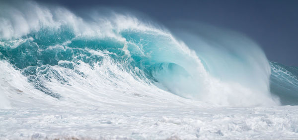 View of waves in sea against sky