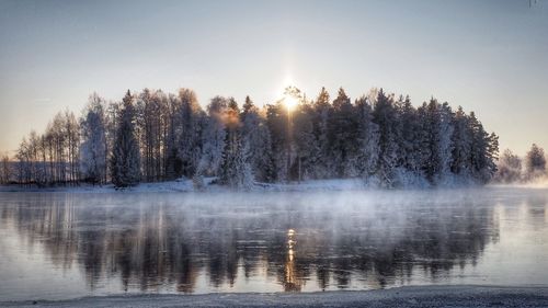 Scenic view of frozen lake against sky