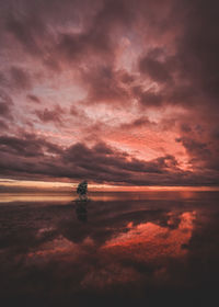 Scenic view of lake against romantic sky at sunset