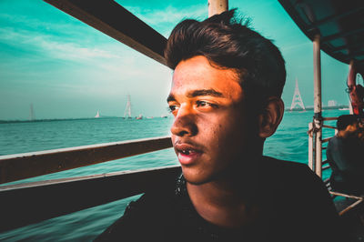 Portrait of a teenager looking out into the waters