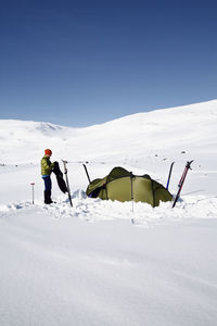 People skiing on snowcapped mountain