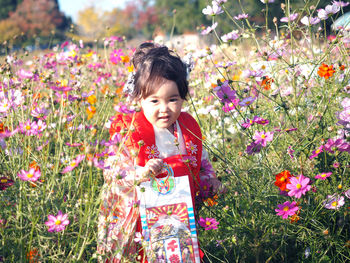 A girl appear from cosmos flowers