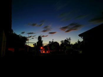 Silhouette trees against sky during sunset