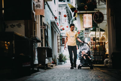 People walking on street in city