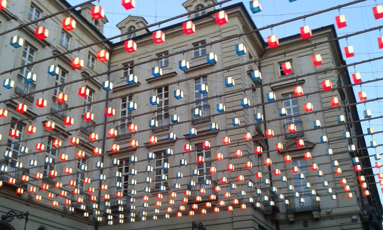 architecture, building exterior, built structure, low angle view, building, city, window, in a row, repetition, no people, modern, outdoors, residential building, illuminated, day, sky, full frame, residential structure, pattern, red