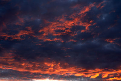 Low angle view of dramatic sky during sunset