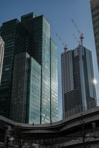 Low angle view of modern buildings against sky