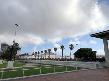 Street by swimming pool against sky