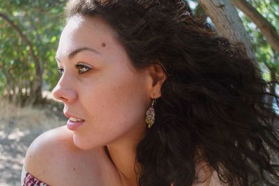 Close-up of young woman looking away