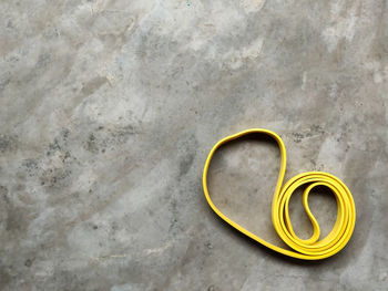 High angle view of yellow paper over white background