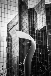 Close-up of glass window against building