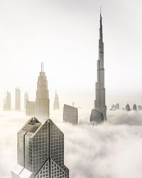 Skyscrapers in city against clear sky