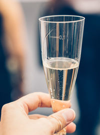 Close-up of hand holding glass of wine