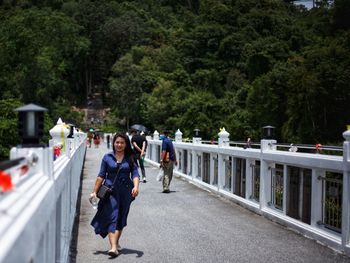 People walking on footbridge