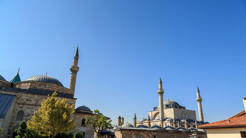 Panoramic view of mosque against clear blue sky