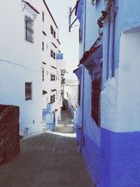 Narrow alley amidst buildings in town