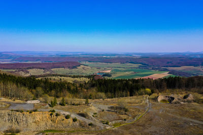 Scenic view of landscape against blue sky