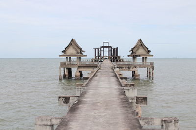 Pier over sea against sky