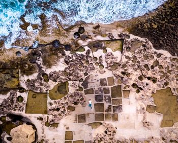 Aerial view of landscape by sea