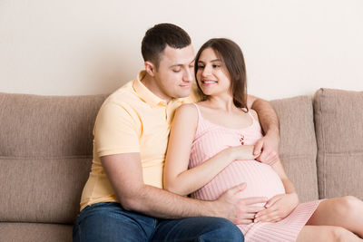 Young couple sitting on sofa