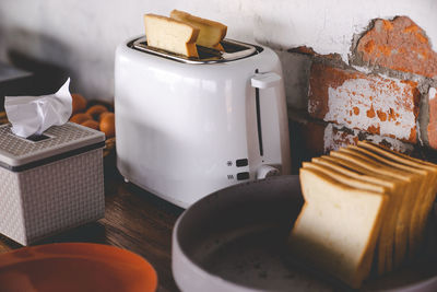 High angle view of bread in toaster on table