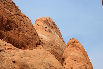 Scenic view of cliff against clear sky