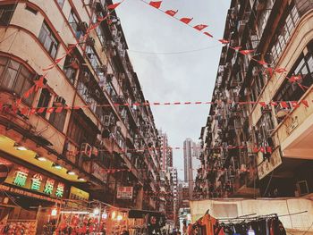 Low angle view of buildings in city against sky