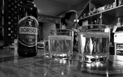 Close-up of beer glasses on table