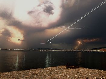 Scenic view of sea against sky at night