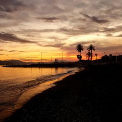 Scenic view of beach against sky during sunset