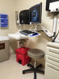 Computer by sink and seat in clinic