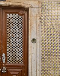 Closed wooden door of old building